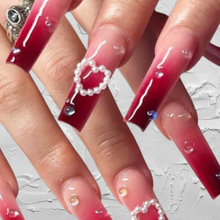 Load image into Gallery viewer, Long red ombre coffin nails with white pearl heart charm
