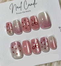 Load image into Gallery viewer, Set of press-on nails with decorative designs on a 'Nail Candi' branded card.
