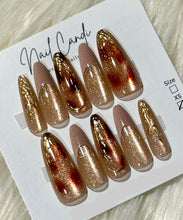 Load image into Gallery viewer, Set of press-on nails with gold and bronze gradient design on a white card with 'Nail Candi' branding.
