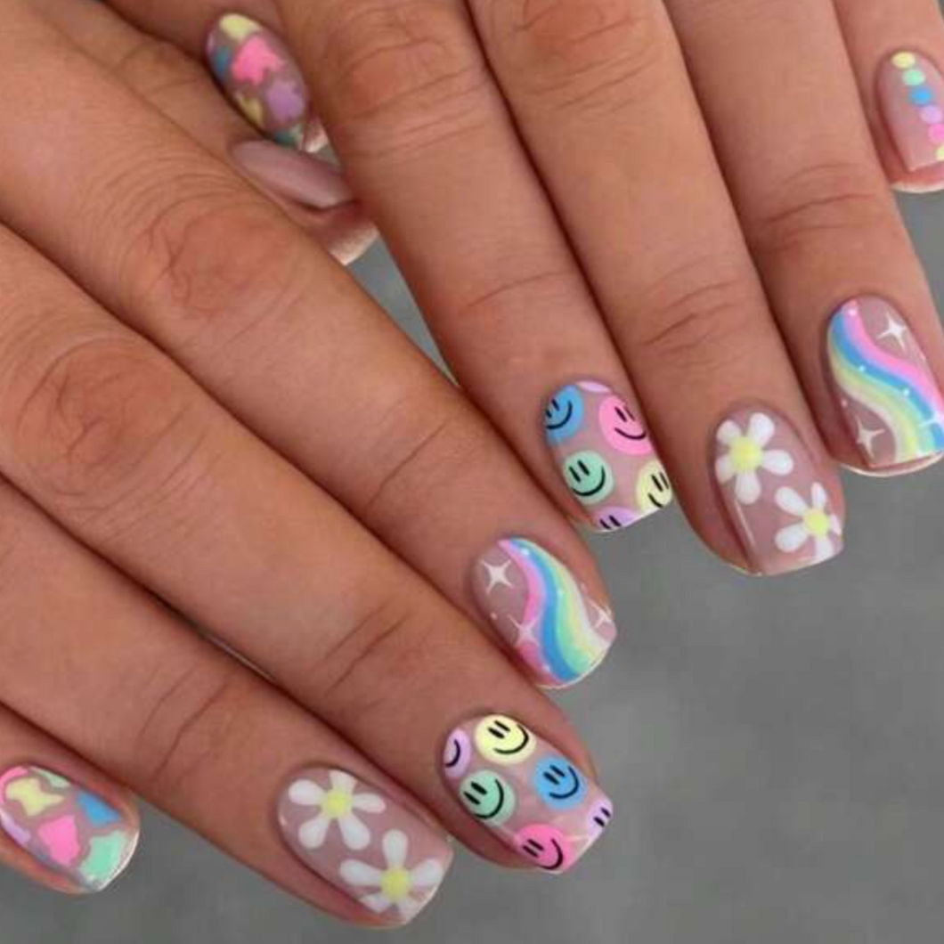 short smiley face rainbow playful nails brightly colored on all fingers