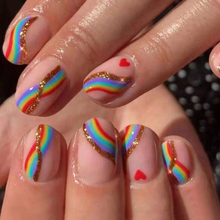 Load image into Gallery viewer, short press on nails with rainbow design and heart accents
