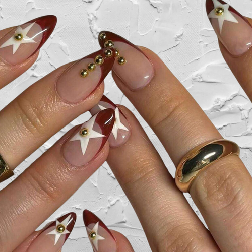 medium almond burgundy french nails with star design and gold studs
