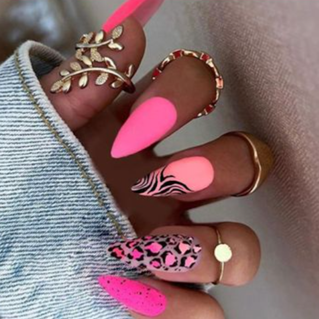 Hot pink stiletto shape nails with black leopard print and zebra designs