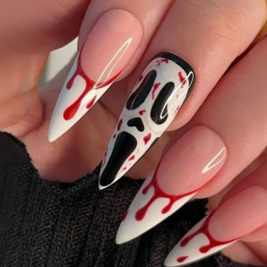 long stiletto shape white french press on nails with red blood drip and scream mask