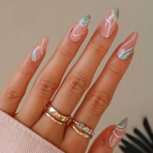 Load image into Gallery viewer, Medium length glossy almond shape fake nails with sage green and white swirls press on nails
