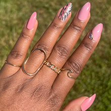 Load image into Gallery viewer, Savannah medium pink almond shape nails with zebra print accent nails

